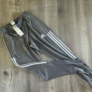 Brand new men’s adidas joggers. Zippered at the ankle-shin, never been worn!